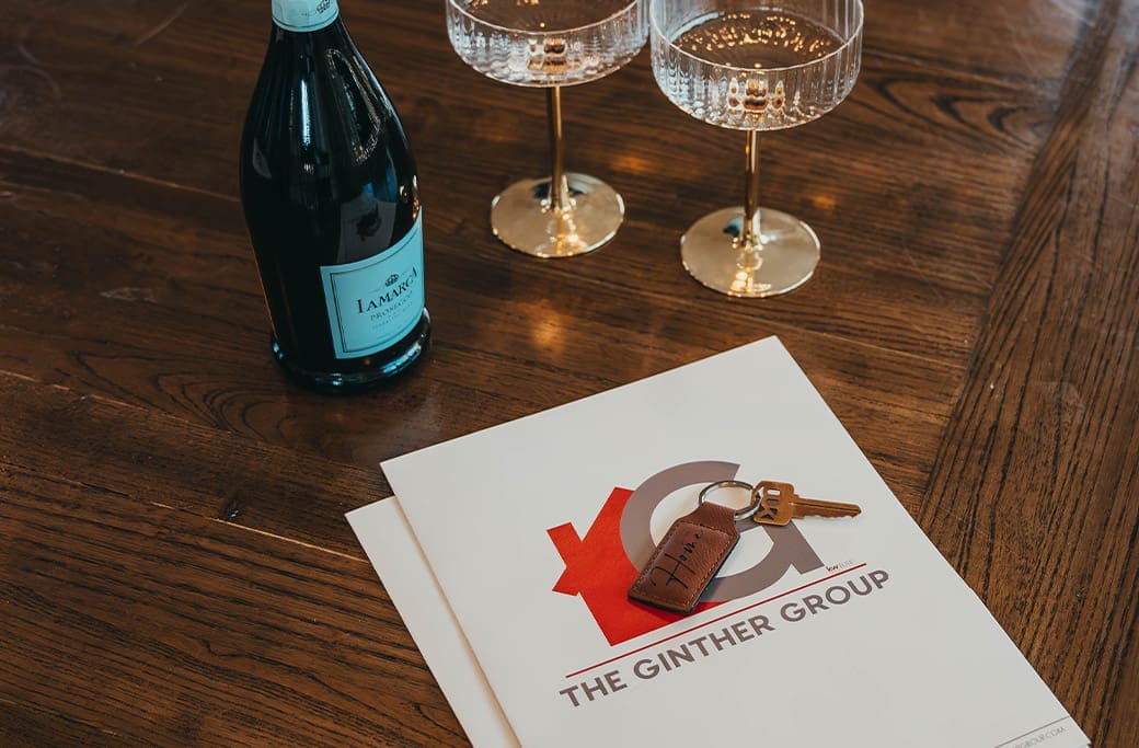 The Ginther Group branded folder with home keys representing the Winston-Salem home buying process